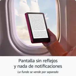 Amazon Kindle Paperwhite 12ª Gen 16GB negro mostrando texto nítido junto a una ventana de avión; pantalla mate sin reflejos, biseles delgados y diseño