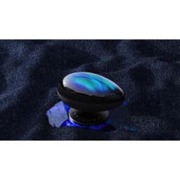Projetor de luz Wanbo EVA Galaxy Light em formato oval preto, com topo translúcido azulado e base compacta, cria efeito de galáxia luminosa sobre