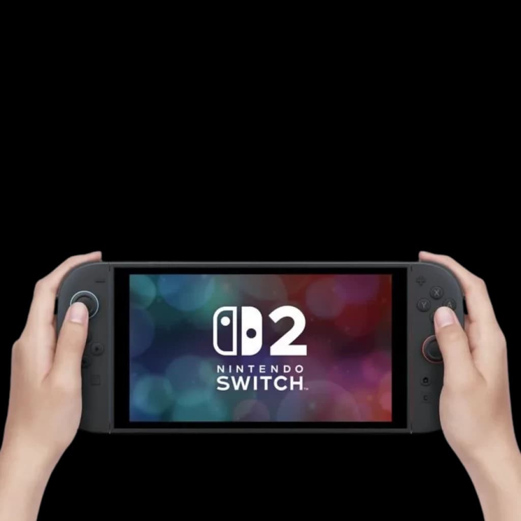 Console portátil Nintendo Switch 2 preto com tela ampla, botões vermelhos e cinza, analógicos ergonômicos e bordas finas, segurado com as duas mãos