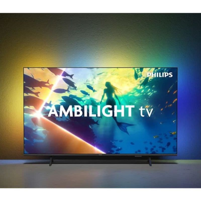 Philips 55PUS8010/12 55" 4K UHD, écran LED noir ultra-fin avec Ambilight multicolore diffusant une lueur immersive derrière le téléviseur.