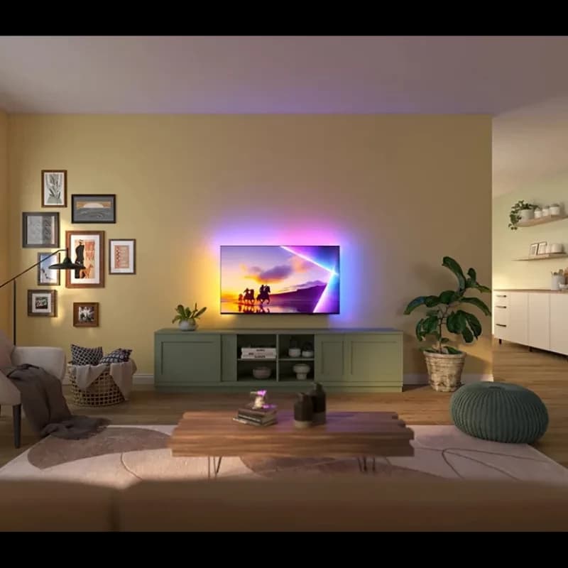 Philips 85PUS8510 85 polegadas 4K QLED com Ambilight, ecrã fino em moldura metálica, luzes LED traseiras coloridas realçando a parede e imagem vibrante