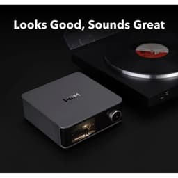 WiiM Ultra - Préamplificateur audio Gris foncé à côté d'un lecteur vinyle