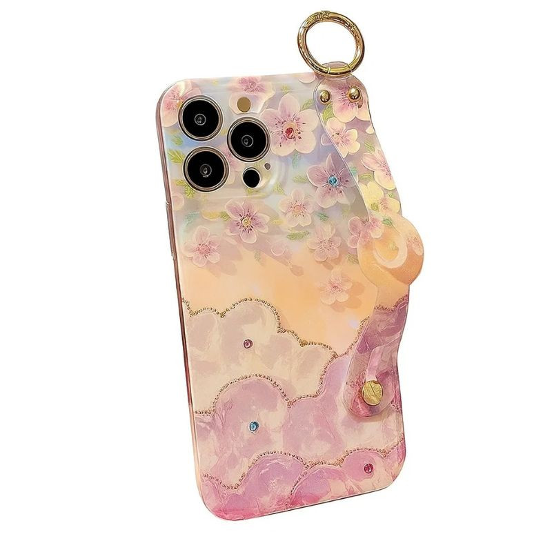 Funda Aurora Floral y Mariposas con pulsera para iPhone 16 en tonos pastel, flores en relieve, mariposas sutiles, brillo nacarado y detalles con pedrería - Ítem