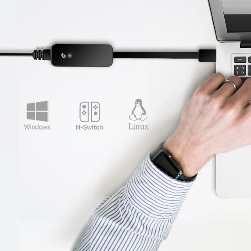 TP-Link UE306: adaptador USB 3.0 compacto, acabamento preto brilhante, cabo curto ligado a laptop. Ícones indicam compatibilidade com Windows, Nintendo Switch