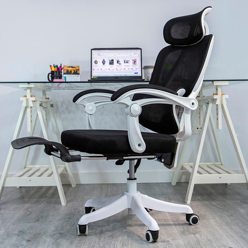 vista frontal y lateral de la Silla de Oficina Powerbasics Confort T20 Negro con reposapiés