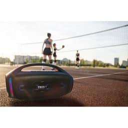 Tribit Stormbox Blast 2 noire portable, poignée intégrée, façade avec haut‑parleurs doubles et lumières LED colorées, design robuste IP67, style urbain